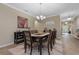 Dining room with seating for eight and view of entryway at 10734 Breaking Rocks Dr, Tampa, FL 33647