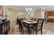 Dining room with seating for eight and view of kitchen at 10734 Breaking Rocks Dr, Tampa, FL 33647