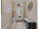 Inviting foyer featuring tile flooring and decorative accents at 10734 Breaking Rocks Dr, Tampa, FL 33647
