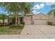 Charming single Gathering home featuring a well-manicured lawn and a spacious two car garage at 10734 Breaking Rocks Dr, Tampa, FL 33647