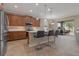 Modern kitchen featuring stainless steel appliances, granite countertops, and a breakfast bar at 10734 Breaking Rocks Dr, Tampa, FL 33647