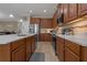Well-lit kitchen featuring stainless steel appliances, light quartz countertops, and wood cabinets at 10734 Breaking Rocks Dr, Tampa, FL 33647