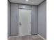 Apartment entrance with a gray door, carpet, and unit number at 111 N 12Th St # 1614, Tampa, FL 33602