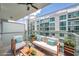 Relaxing balcony with comfortable seating and views of the building's elegant facade at 111 N 12Th St # 1614, Tampa, FL 33602