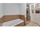Full bathroom featuring a shower, bathtub, cabinets, and tiled walls at 111 N 12Th St # 1614, Tampa, FL 33602