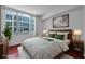 Comfortable bedroom with large windows, hardwood floors, and modern decor creating a serene atmosphere at 111 N 12Th St # 1614, Tampa, FL 33602