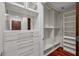 Walk-in closet with built-in shelving and mirrored drawers for ample storage at 111 N 12Th St # 1614, Tampa, FL 33602