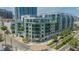 Corner view of a six-story condo building with a coffee shop at 111 N 12Th St # 1614, Tampa, FL 33602