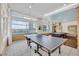 Well-lit game room with a ping pong table and a pool table, perfect for entertainment at 111 N 12Th St # 1614, Tampa, FL 33602