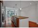 Open kitchen featuring a large island with seating, stainless steel appliances, and pendant lighting at 111 N 12Th St # 1614, Tampa, FL 33602