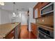 Contemporary kitchen with stainless steel appliances, quartz countertops, and modern cabinetry at 111 N 12Th St # 1614, Tampa, FL 33602