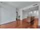 Bright living room with hardwood floors and recessed lighting next to the open-concept kitchen and a glimpse of the bathroom at 111 N 12Th St # 1614, Tampa, FL 33602