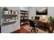 Well-lit office with hardwood floors, floating bookshelves, and a modern desk, perfect for a productive workspace at 111 N 12Th St # 1614, Tampa, FL 33602