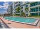 Beautiful pool with nearby modern building. Palm trees and other vegetation nearby at 111 N 12Th St # 1614, Tampa, FL 33602