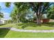 Spacious backyard with mature trees and a stone path, providing a peaceful outdoor retreat at 125 Siobhan Ave, Tampa, FL 33613