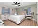 Comfortable bedroom with neutral paint, wood floors, and a large window providing natural light at 125 Siobhan Ave, Tampa, FL 33613