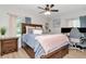 Bedroom with hardwood floors, neutral paint, a large bed, and a work-from-home area at 125 Siobhan Ave, Tampa, FL 33613