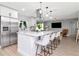Modern kitchen with stainless appliances, pendant lighting, and a white island with seating at 125 Siobhan Ave, Tampa, FL 33613