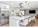 Bright kitchen features stainless steel appliances, a large island with seating, and modern pendant lighting at 125 Siobhan Ave, Tampa, FL 33613