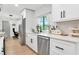 Bright kitchen features stainless steel appliances, white cabinets, and a view into the office at 125 Siobhan Ave, Tampa, FL 33613