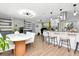 Open-concept living area with a kitchen island, dining space, and modern finishes at 125 Siobhan Ave, Tampa, FL 33613