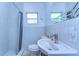 Updated bathroom features a sleek sink, modern faucet, and shower with new tile at 13329 N Armenia Ave, Tampa, FL 33613