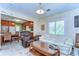Cozy living area flowing into a dining space and kitchen, perfect for seamless entertaining and Gathering living at 13329 N Armenia Ave, Tampa, FL 33613