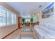 Bright living room featuring large windows, a modern sofa, and stylish decor at 13329 N Armenia Ave, Tampa, FL 33613