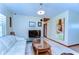 Inviting living room area is bright, spacious, and features tile floors at 13329 N Armenia Ave, Tampa, FL 33613