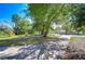 View of the Lake George Estates neighborhood featuring a treed lot and inviting community entrance at 13329 N Armenia Ave, Tampa, FL 33613