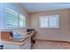 Naturally lit office with laminate floors has ample space for storage and a work surface at 13329 N Armenia Ave, Tampa, FL 33613