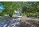 Scenic street view with mature trees and an inviting entrance to a beautiful neighborhood at 13329 N Armenia Ave, Tampa, FL 33613