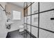 Updated bathroom with black and white tiles, a modern shower, and sleek fixtures at 136 30Th N Ave, St Petersburg, FL 33704