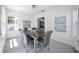 Dining room with a wood table, gray chairs, and natural light from a window at 136 30Th N Ave, St Petersburg, FL 33704