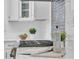 Kitchen detail showcasing a stylish backsplash, gas range, and counter decor at 136 30Th N Ave, St Petersburg, FL 33704