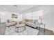 Cozy living room featuring dark hardwood floors, neutral furnishings, and an area rug at 136 30Th N Ave, St Petersburg, FL 33704