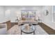 Bright living room with hardwood floors, a modern sofa, and an abundance of natural light at 136 30Th N Ave, St Petersburg, FL 33704