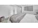 Bright main bedroom showcasing doors to the exterior, neutral decor, and serene atmosphere at 136 30Th N Ave, St Petersburg, FL 33704