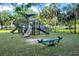 A colorful playground is nestled in a park-like setting with slides, seesaws, and plenty of space for fun at 136 30Th N Ave, St Petersburg, FL 33704