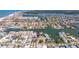 Overhead shot featuring a canal-laced community offering waterfront homes, private docks, and stunning bay access at 145 174Th Terrace E Dr, Redington Shores, FL 33708