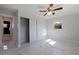 Bedroom with a ceiling fan, closet, and a doorway to another room at 145 174Th Terrace E Dr, Redington Shores, FL 33708