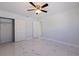 Bright bedroom featuring modern lighting, closets, and doorway to another room at 145 174Th Terrace E Dr, Redington Shores, FL 33708