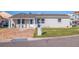 Inviting single-story home with brick driveway and well-maintained landscaping at 145 174Th Terrace E Dr, Redington Shores, FL 33708