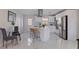 A stylish kitchen featuring an island with seating, stainless steel appliances, and bright white cabinets at 145 174Th Terrace E Dr, Redington Shores, FL 33708