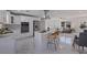 Bright, open kitchen with marble floors, stainless steel appliances, and an island with bar seating at 145 174Th Terrace E Dr, Redington Shores, FL 33708