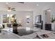 A kitchen with an island cooktop, stainless steel appliances, open concept and access to an outside entrance at 145 174Th Terrace E Dr, Redington Shores, FL 33708