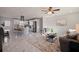 Open-concept living room and kitchen featuring elegant flooring and modern fixtures at 145 174Th Terrace E Dr, Redington Shores, FL 33708