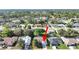 Aerial view of home in a quiet neighborhood featuring mature trees, close to amenities at 1472 Overland Dr, Spring Hill, FL 34608