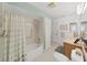 The bathroom features a shower/tub combo with tiled walls and updated fixtures at 1472 Overland Dr, Spring Hill, FL 34608