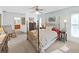 Cozy bedroom with a decorative metal bed frame, soft carpet, and natural light at 1472 Overland Dr, Spring Hill, FL 34608